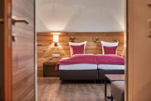 Ένα ή περισσότερα κρεβάτια σε δωμάτιο στο Hotel Schachner