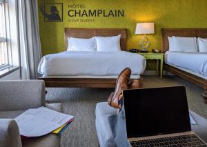 Postel nebo postele na pokoji v ubytování Hotel Champlain