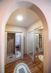 a room with an archway with a room to die sign at Apartment Africa in Belgrade +36 photos