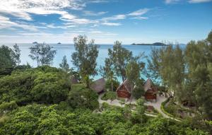 an aerial view of a resort with the ocean in the background at Constance Tsarabanjina - All Inclusive in Nosy Mitsio