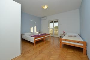 Postel nebo postele na pokoji v ubytování Villa Medic