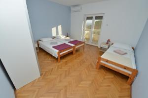 Postel nebo postele na pokoji v ubytování Villa Medic