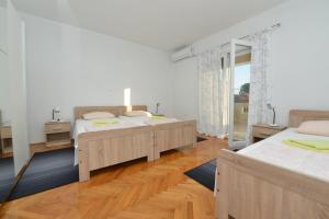 Postel nebo postele na pokoji v ubytování Villa Medic + 37 fotografií