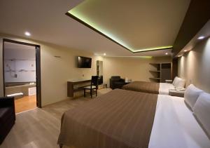 Postel nebo postele na pokoji v ubytování Hotel Escala Central del Norte + 37 fotografií