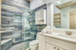 a bathroom with a shower and a toilet and a sink at Executive Bay Club Condo M-1 in Islamorada