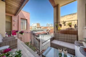a balcony with a view of a city at B&B Ebo in Olbia