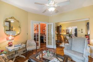 a living room with two chairs and a table at The Inn on Holly B&B in Pitman