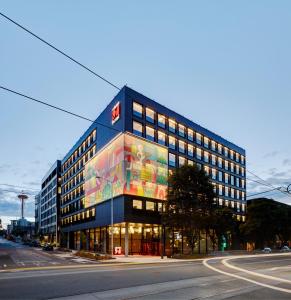 a building with a painting on the side of it at citizenM Seattle South Lake Union in Seattle