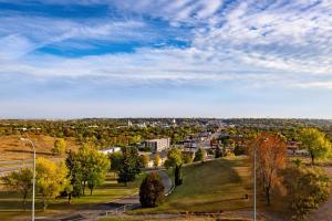 a view of a city from a hill with street lights at Grand Hotel in Minot