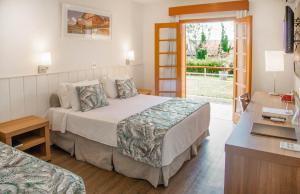 A bed or beds in a room at Monreale Resort Parque Aquático