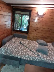 Una cama o camas en una habitación de Brvnara Maljkovic Drina