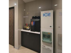 a ice machine in a room with a microwave at Hotel Halrotto Fukuoka Hakata - Vacation STAY 04193v in Fukuoka