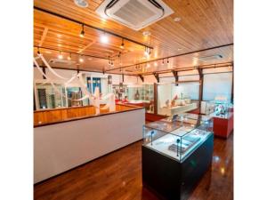 a display case in a room with wood ceilings at Hotel Halrotto Fukuoka Hakata - Vacation STAY 04193v in Fukuoka