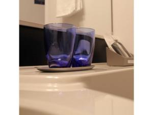 a pair of blue glasses sitting on top of a counter at Hotel Halrotto Fukuoka Hakata - Vacation STAY 04185v in Fukuoka