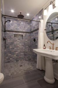 a bathroom with a sink and a shower at Belle Louise Historic Bed & Breakfast in Paducah