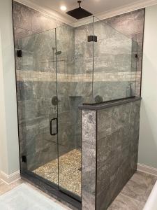 a shower with a glass door in a bathroom at Belle Louise Historic Bed & Breakfast in Paducah +37 photos