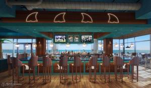 a restaurant with a bar with a view of the ocean at Margaritaville Jacksonville Beach in Jacksonville Beach