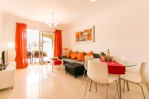 a living room with a couch and a table at Apartamento San Remo Soleado in Palm-Mar