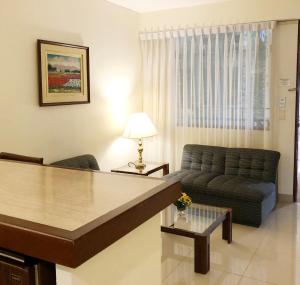 a living room with a couch and a table at Hotel Boulevard in Lima