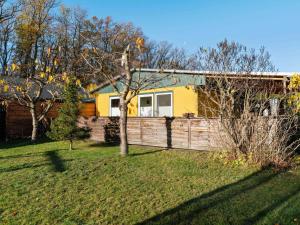 a house with a fence in a yard at Holiday home near the Braunlage ski resort in Wienrode