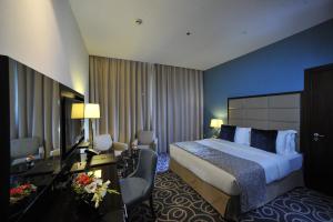 Voodi või voodid majutusasutuse Ramada Abu Dhabi Corniche toas