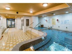 a large indoor swimming pool in a building at Hotel Taisei Annex - Vacation STAY 05217v in Kagoshima