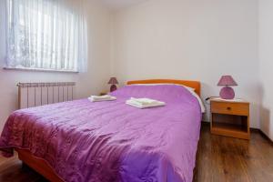 Posteľ alebo postele v izbe v ubytovaní Apartments Marissimo