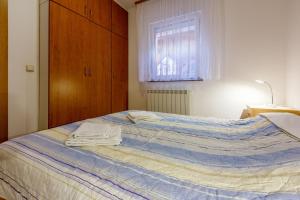 Posteľ alebo postele v izbe v ubytovaní Apartments Marissimo