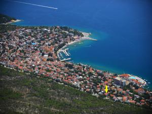 an aerial view of a city with a harbor and the water at Apartments Robic in Selce