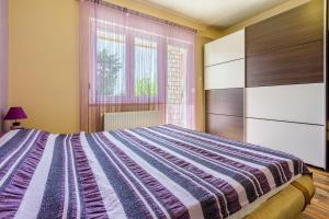 Posteľ alebo postele v izbe v ubytovaní Apartments SENKA