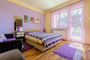 Posteľ alebo postele v izbe v ubytovaní Apartments SENKA