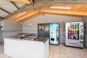 a gas station with two soda machines and a counter at Discovery Parks - Melbourne in Braybrook