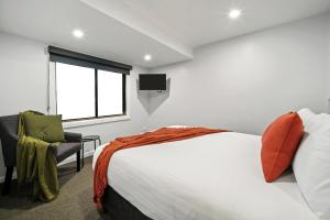 Postel nebo postele na pokoji v ubytování Merewether Motel