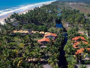 an aerial view of a resort next to a beach at Feriasmares in Ilhéus