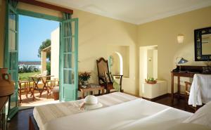 A bed or beds in a room at Kalimera Kriti Hotel & Village Resort