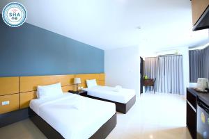 Кровать или кровати в номере Lee Hotel