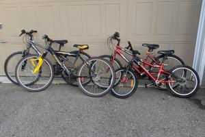 a group of bikes parked next to a garage at Cottage with River Front & minutes away from Beach in Wasaga Beach