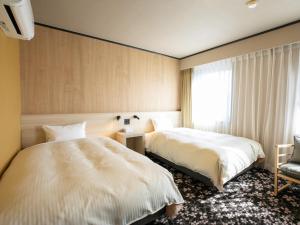 Maizuru Grand Hotel客房内的一张或多张床位