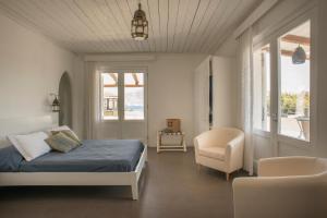 Un pat sau paturi într-o cameră la Mari del Sud Resort