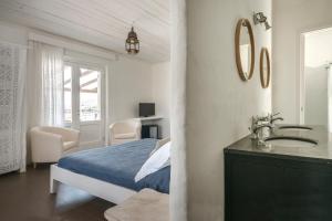 Un pat sau paturi într-o cameră la Mari del Sud Resort