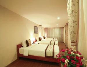 Llit o llits en una habitació de Cosiana Sapa Hotel