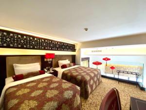 Cama ou camas em um quarto em Hotel Metropole