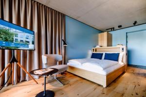 Cama ou camas em um quarto em THE FLAG West M.