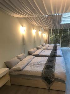 Letto o letti in una camera di Yun Ting Orchid Garden