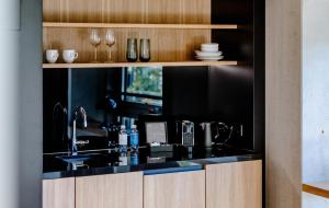 A cozinha ou cozinha compacta de THE FLAG West M.