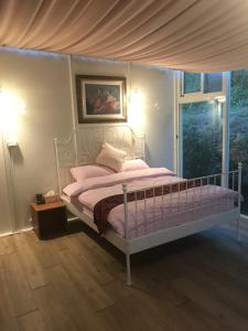 Letto o letti in una camera di Yun Ting Orchid Garden