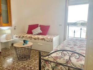 Posteľ alebo postele v izbe v ubytovaní Casa del Faro By Cala Salento