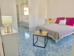 Posteľ alebo postele v izbe v ubytovaní Casa del Faro By Cala Salento