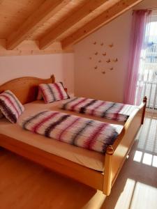 A bed or beds in a room at Ferienwohnung Christine