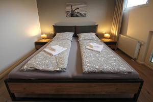 Postel nebo postele na pokoji v ubytování Haus Fichtl, Alpenblick 402 oder Nebelhornblick 403